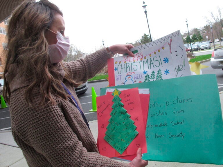 Kathleen Schallus sorts through holiday cards sent to Shore Medical Center