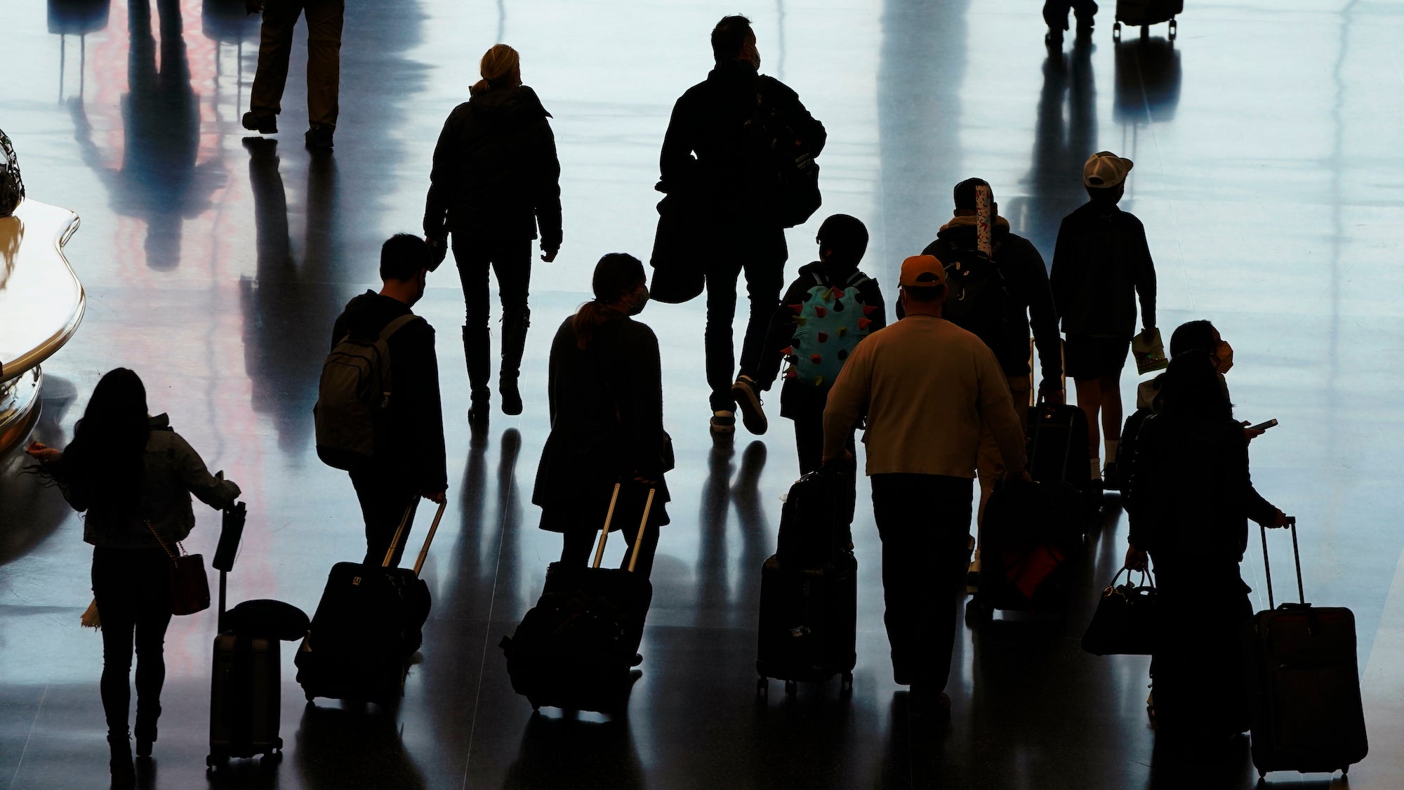 Travelers walk through the Salt Lake City International Airport