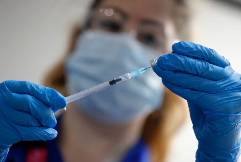 A nurse prepares to administer the Pfizer-BioNTech COVID-19 vaccine at Guy’s Hospital in London