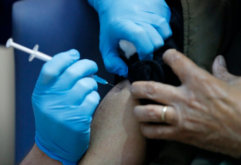 A nurse administers the Pfizer-BioNTech COVID-19 vaccine at Guy’s Hospital in London