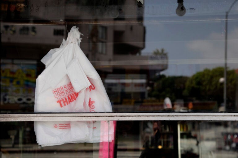 Plastic bags can be seen through the window of a restaurant