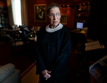 Ruth Bader Ginsburg poses for a photo in her chambers at the Supreme Court in Washington