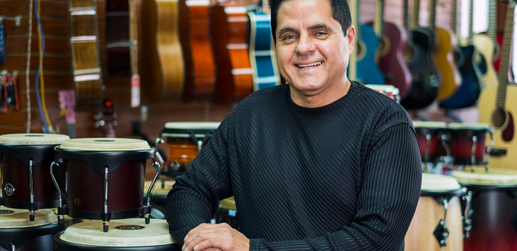 Reinaldo Meléndez took over Centro Musical in 2014 after the former owner, Wilfredo Gonzalez, retired. | Reinaldo Meléndez se hizo cargo de Centro Musical en 2014 después de que el ex propietario, Wilfredo González, se retirara. (Photo by Bernardo Morillo for WHYY)