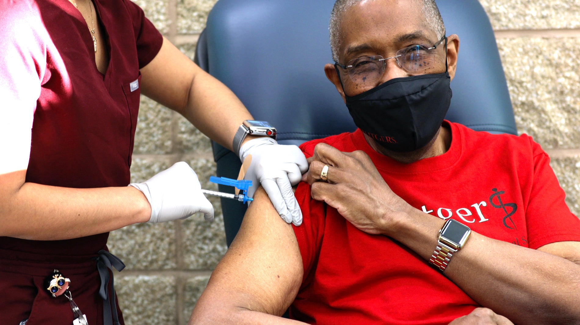 Robert Johnson, dean of Rutgers New Jersey Medical School, receives his first COVID-19 shot. 