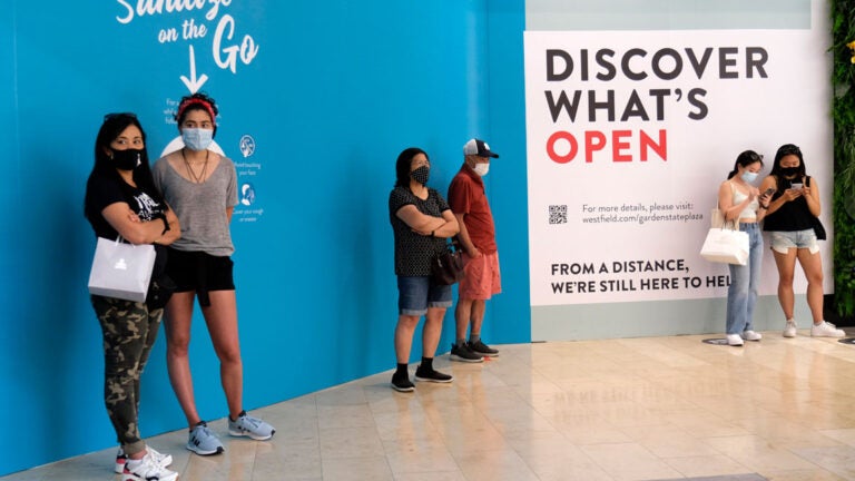 In this June 29, 2020, customers waited in line to enter a store at Garden State Plaza in Paramus, New Jersey. (Seth Wenig/AP Photo) 