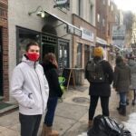 Nick Lukow waits in line to enter the Ocassionate Gift shop in South Philly. He's 8th in line, but unflustered: 