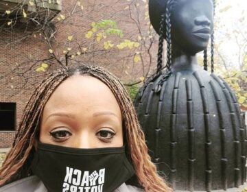 Jamie Gauthier poses for a photo next to 'Brick House,' a sculpture installed on the UPenn campus in 2020 (Jamie Gauthier/Facebook)