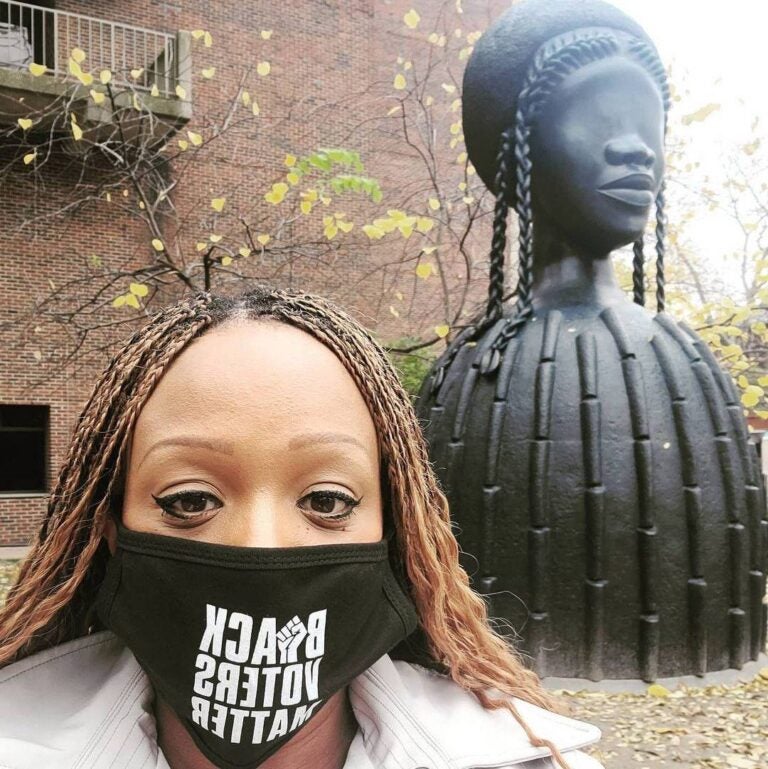 Jamie Gauthier poses for a photo next to 'Brick House,' a sculpture installed on the UPenn campus in 2020 (Jamie Gauthier/Facebook)