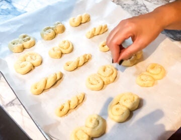 Culinary arts teacher Mrs. Mylonas shows how to make special Greek cookies