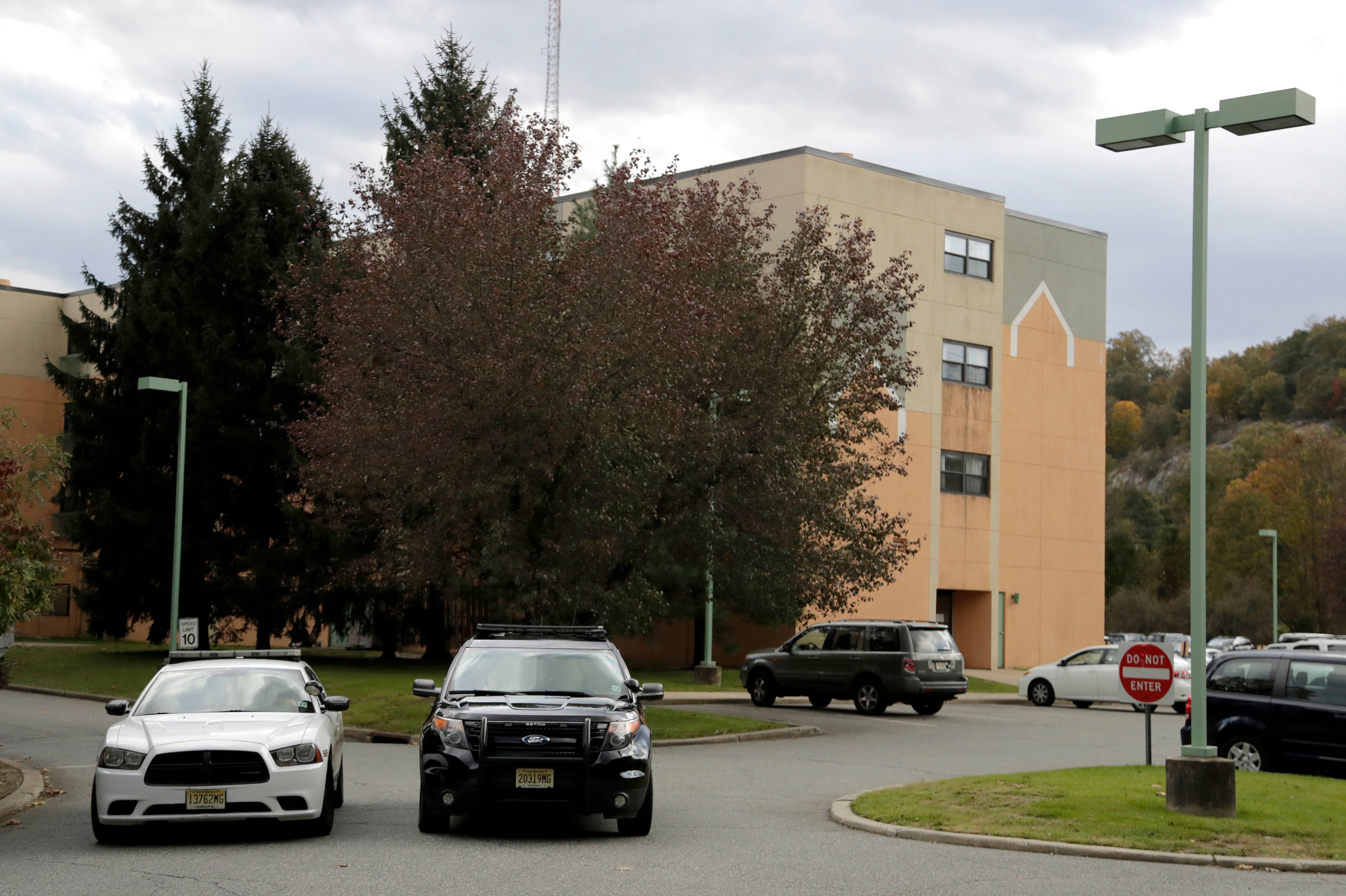 Police cruisers are seen parked near the entrance of the Wanaque Center For Nursing And Rehabilitation