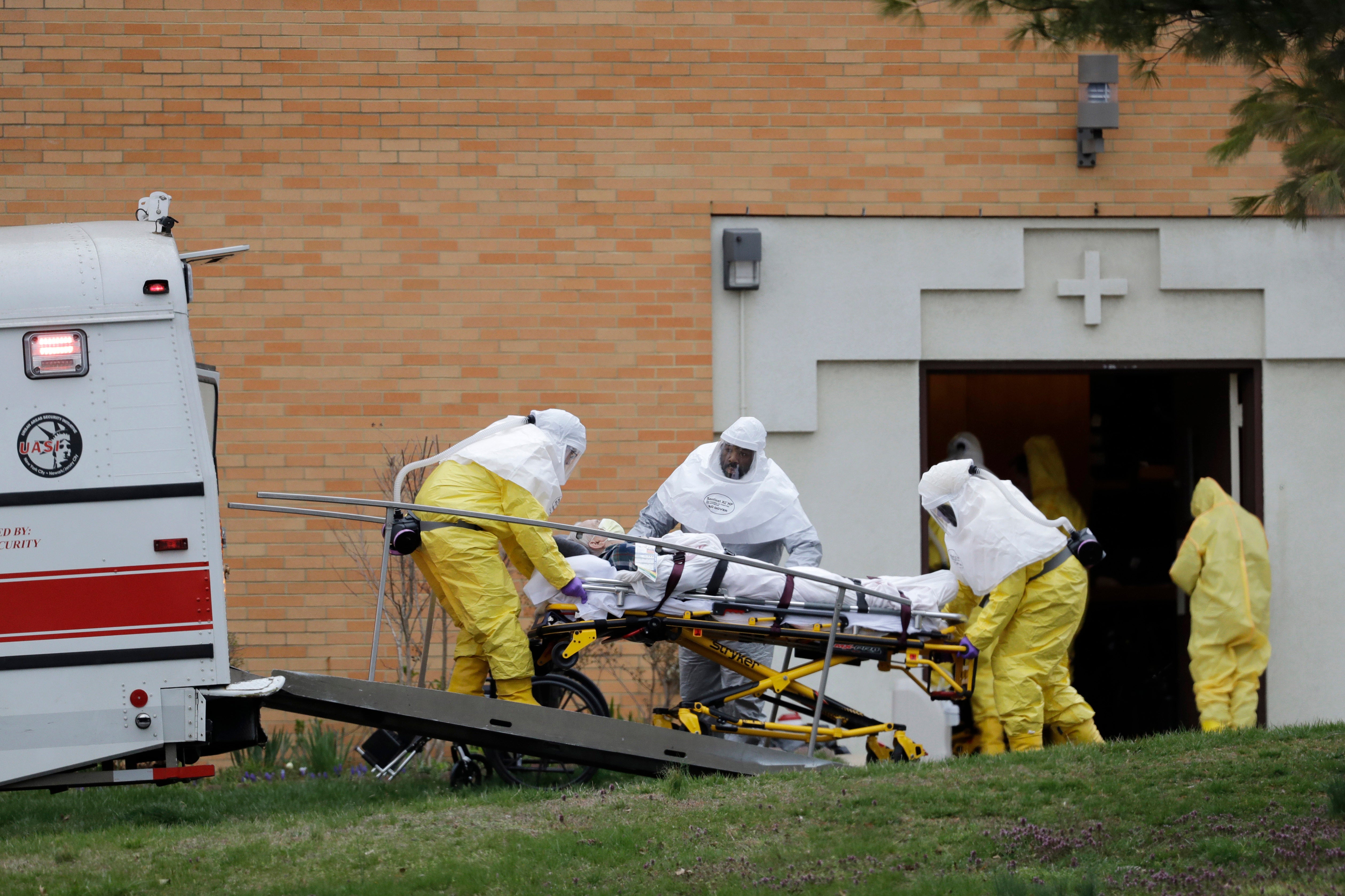 A resident from St. Joseph's Senior Home is loaded into a bus in Woodbridge, N.J.