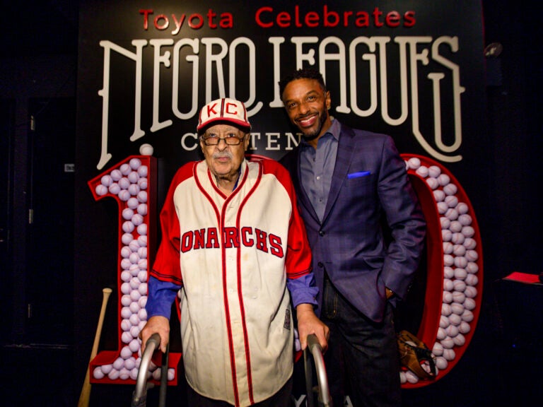 Negro Leagues baseball veteran Jim Robinson and ESPN/ABC correspondent Ryan Smith attend an event celebrating 100th anniversary of the league in New York in February. (Donald Traill/AP Photo)