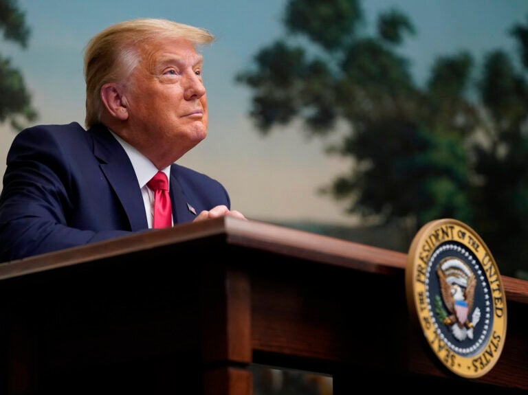 President Trump participates in a video teleconference call with members of the military on Thanksgiving at the White House.