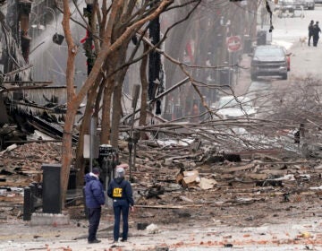 Emergency personnel work near the scene of an explosion in downtown Nashville