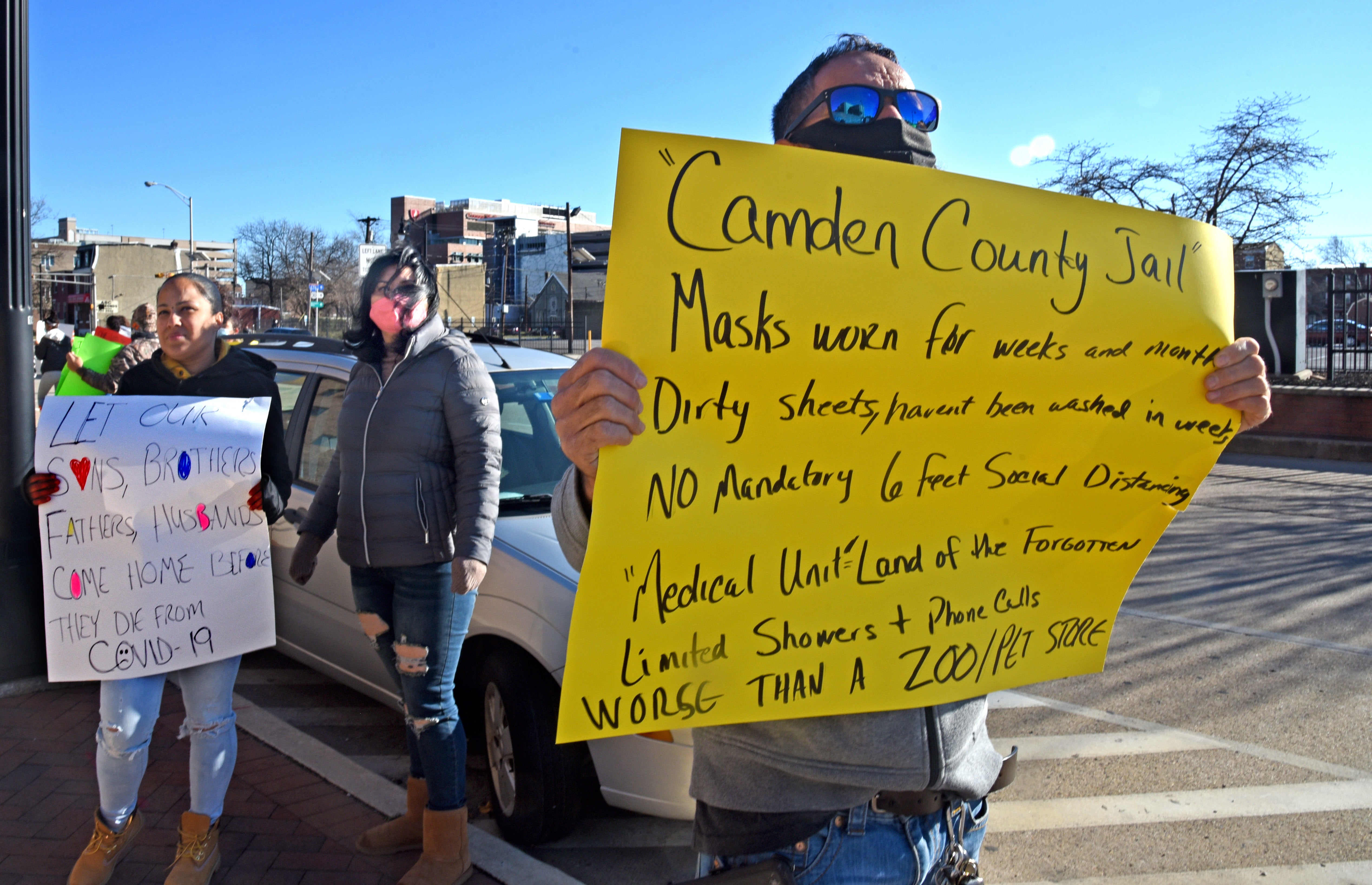 Friends and family members of people who are incarcerated at Camden County jail protest the facility's handling of the COVID-19 pandemic outside the facility on Dec. 6.