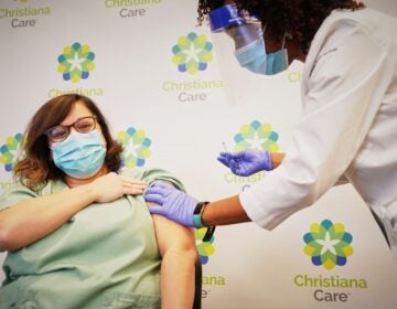 ChristianaCare employee Kathleen Bonis gets the COVID vaccine in December 2020. (State of Delaware)