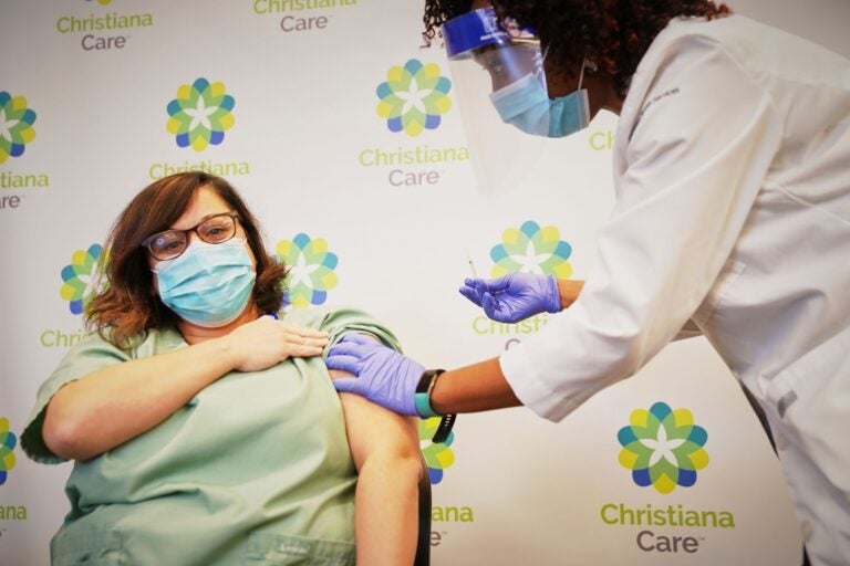 ChristianaCare employee Kathleen Bonis gets the COVID vaccine in December 2020. (State of Delaware)