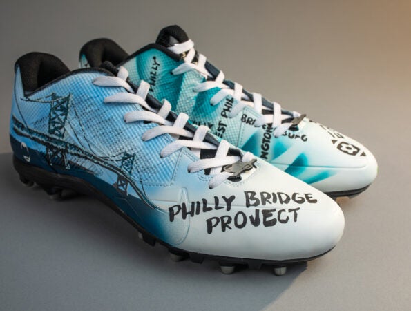 Customized cleats for Zach Ertz feature the Philly Bridge Project