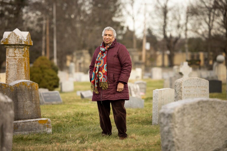 Joyce Mosley stands in Eden Cemetery