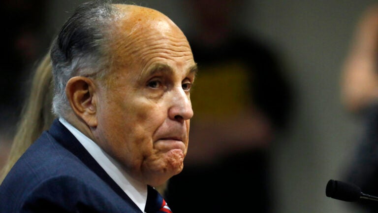 Rudy Giuliani, personal lawyer of President Trump, looks on during an appearance before the Michigan House Oversight Committee in Lansing, Mich., on Dec. 2. Rudy Giuliani looks on during an appearance before the Michigan House Oversight Committee
