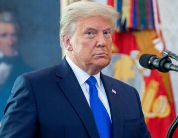 President Trump threatened a hard-fought relief bill passed by Congress on Monday, calling it 