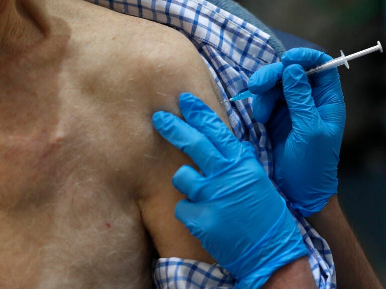 A nurse administers the Pfizer-BioNTech COVID-19 vaccine at Guy's Hospital