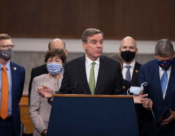 Sen. Mark Warner (D-VA) speaks alongside a bipartisan group of Democrat and Republican members of Congress as they announce a proposal for a $908 billion Covid-19 relief bill