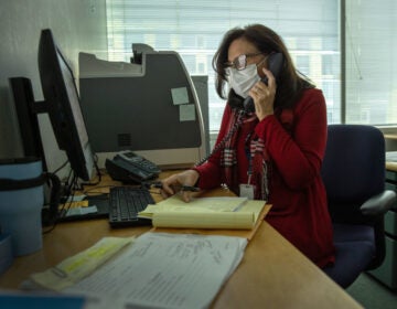Contact tracer Toni Parlanti of Stamford, Conn., calls a person identified as having been potentially exposed to the coronavirus this week. States and territories report they have more than 70,000 people working on contact tracing as of December. (John Moore/Getty Images)