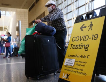 The U.S. Centers for Disease Control and Prevention issued a new coronavirus testing mandate for travelers coming from the U.K. with the goal of blocking the spread of a new virus variant that originated in England. (Mario Tama/Getty Images)