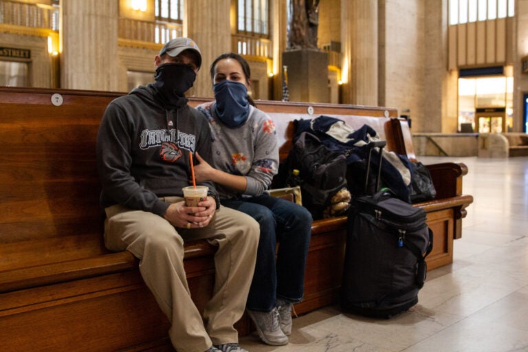 Gloriana Berry (right) and Kent Berry sit at 30th Street Station