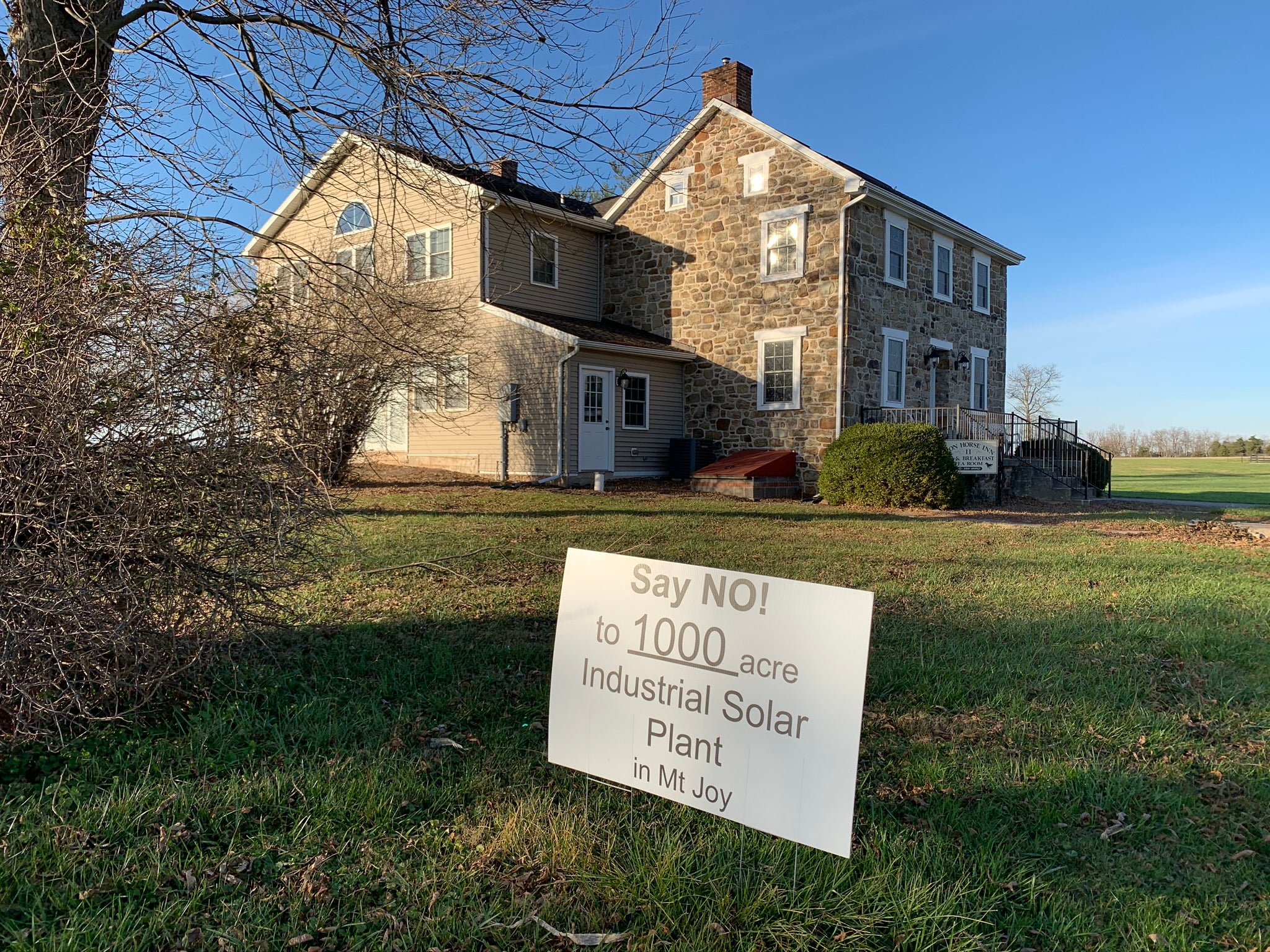 One of the many signs protesting a proposed solar project in Mount Joy Township, Adams County is seen here in front of the Iron Horse Inn on Nov. 24