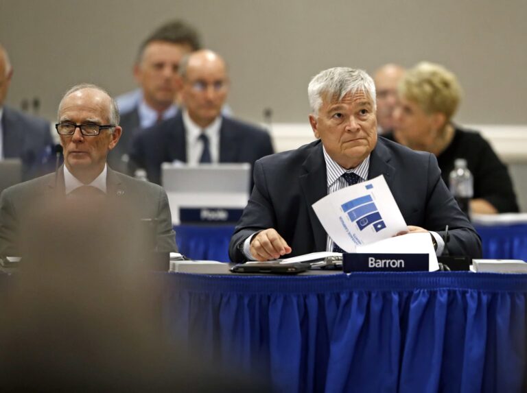 FILE PHOTO: Penn State President Eric J. Barron, right, listens during a Penn State University Board of Trustees meeting on the campus of Penn State Harrisburg in Middletown, Pa., Friday, July 21, 2017. (Chris Knight / AP Photo)