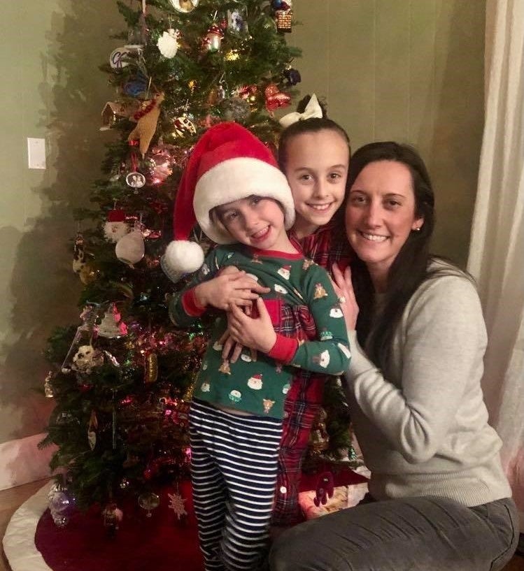 Five-year-old Grant and Brooke Dell Orto, 8, and their mom, Elizabeth Pruitt in front of their Christmas tree