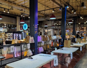 Bags of delivery groceries being prepared at Reading Terminal Market during the pandemic in April 2020.