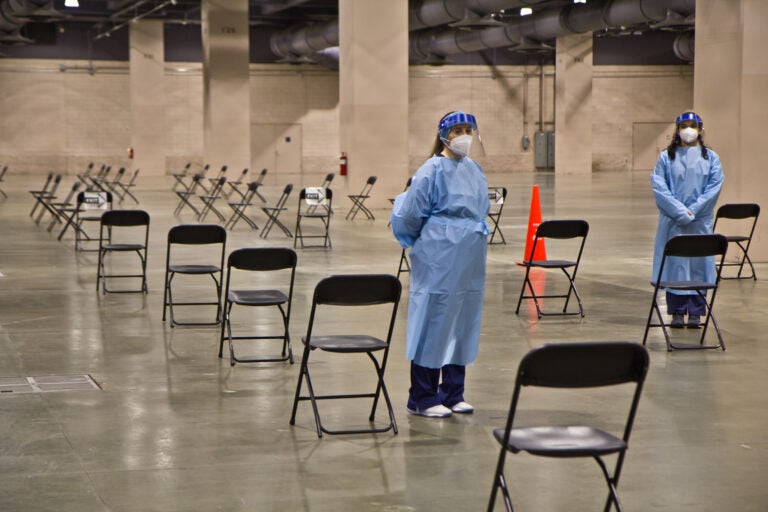 After receiving the vaccination, patients wait under observation at the mass vaccine clinic at the Pennsylvania Convention Center. (Kimberly Paynter/WHYY)