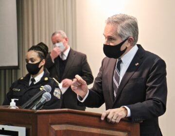 Philadelphia District Attorney Larry Krasner appears as a podium