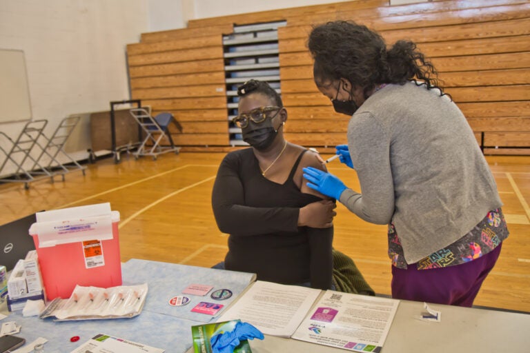 Bartram High School nurse Monica Harmon said she was excited to receive the Moderna COVID-19 vaccine at the city’s school nurse vaccination clinic on Jan. 22, 2021. (Kimberly Paynter/WHYY)