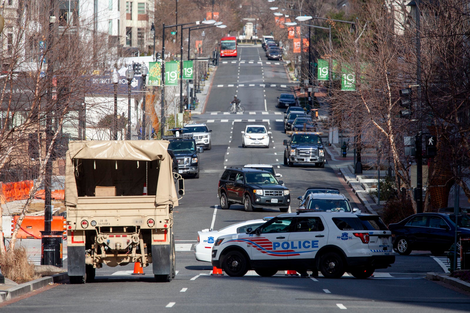 Military and police vehicles block off street traffic in D.C.