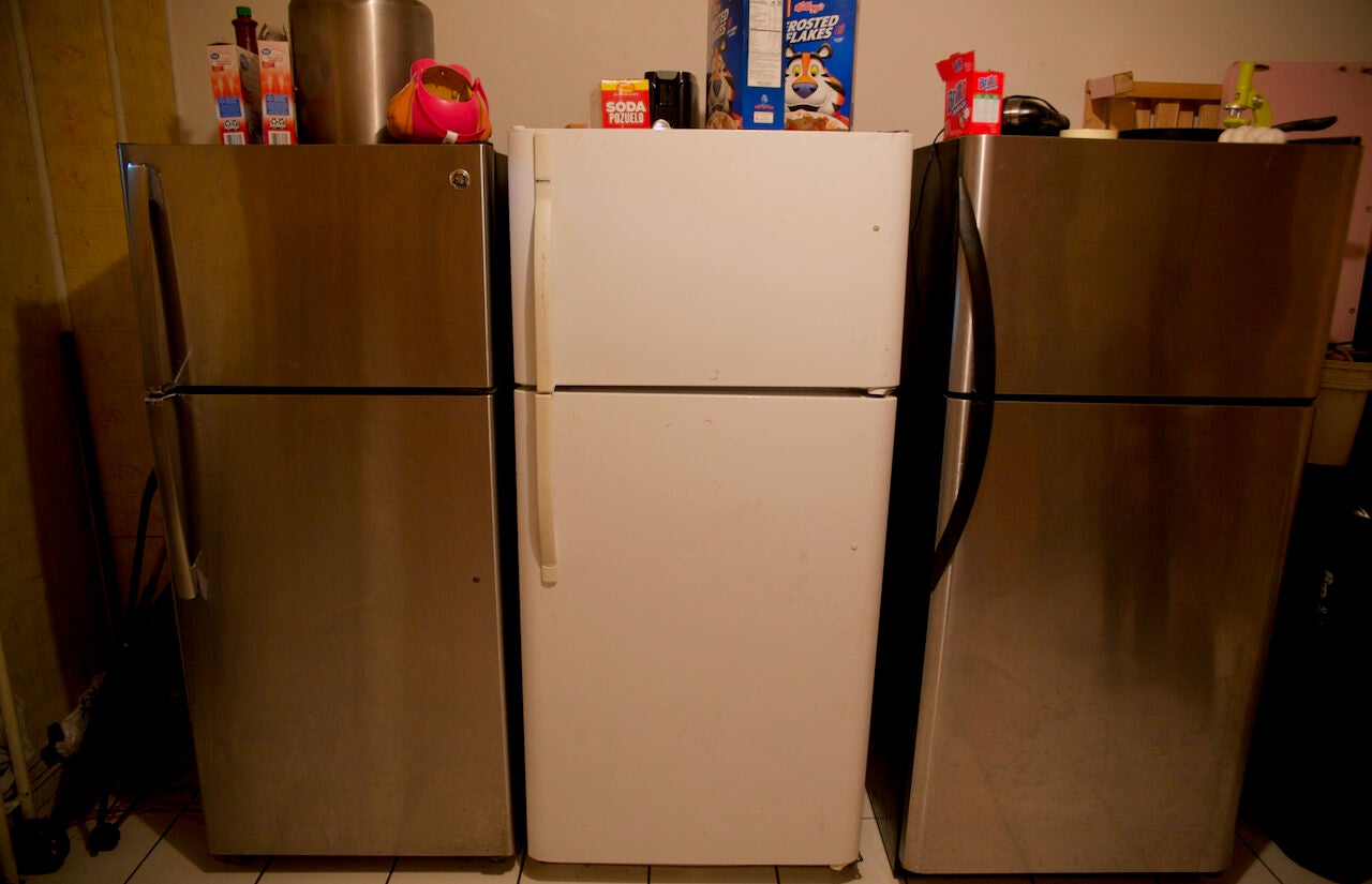 The apartment has three refrigerators — one for each family who lives there. | El apartamento tiene tres refrigeradores, uno para cada familia que vive allí. (Tony Rocco/WHYY)