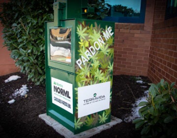 An old newspaper box holds marijuana pardon applications