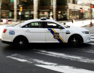 File photo: A police car drives in Philadelphia, Tuesday, March 24, 2020. (AP Photo/Matt Rourke)