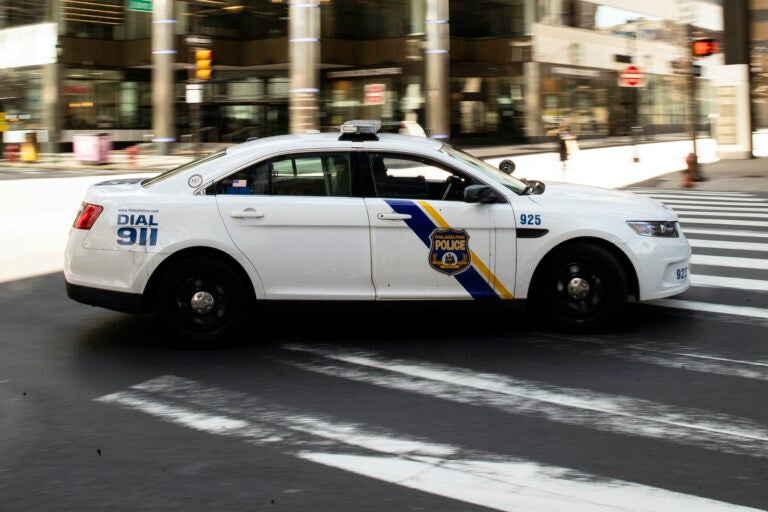 File photo: A police car drives in Philadelphia, Tuesday, March 24, 2020. (AP Photo/Matt Rourke)