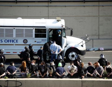 Police detain protesters in the aftermath of a march calling for justice over the death of George Floyd on Interstate 676 in Philadelphia, Monday, June 1, 2020. Floyd died after being restrained by Minneapolis police officers on May 25. (AP Photo/Matt Rourke)