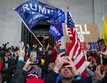 Trump supporters gather outside the Capitol, Wednesday, Jan. 6, 2021, in Washington. (AP Photo/John Minchillo)