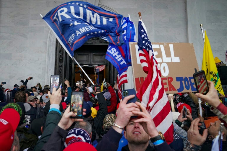 Trump supporters gather outside the Capitol, Wednesday, Jan. 6, 2021, in Washington. (AP Photo/John Minchillo)