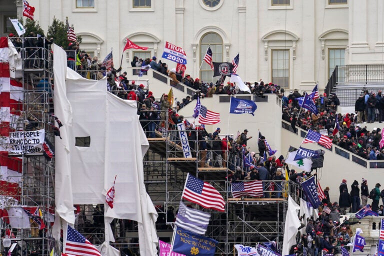 Pro-Trump insurrectionists gather outside the Capitol