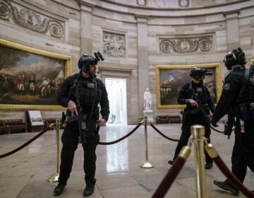 Members of the U.S. Secret Service Counter Assault Team walk through the Rotunda as they and other federal police forces responded as violent protesters loyal to President Donald Trump stormed the U.S. Capitol today, at the Capitol in Washington, Wednesday, Jan. 6, 2021. (AP Photo/J. Scott Applewhite)