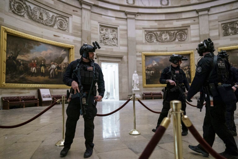 Members of the U.S. Secret Service Counter Assault Team walk through the Rotunda as they and other federal police forces responded as violent protesters loyal to President Donald Trump stormed the U.S. Capitol today, at the Capitol in Washington, Wednesday, Jan. 6, 2021. (AP Photo/J. Scott Applewhite)