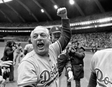 FILE - Los Angeles Dodgers manager Tom Lasorda celebrates after the Dodgers beat the Montreal Expos for the National League title in Montreal, in this Monday, Oct. 19, 1981, file photo. Tommy Lasorda, the fiery Hall of Fame manager who guided the Los Angeles Dodgers to two World Series titles and later became an ambassador for the sport he loved during his 71 years with the franchise, has died. He was 93. The Dodgers said Friday, Jan. 8, 2021, that he had a heart attack at his home in Fullerton, California.  (AP Photo/Grimshaw, File)