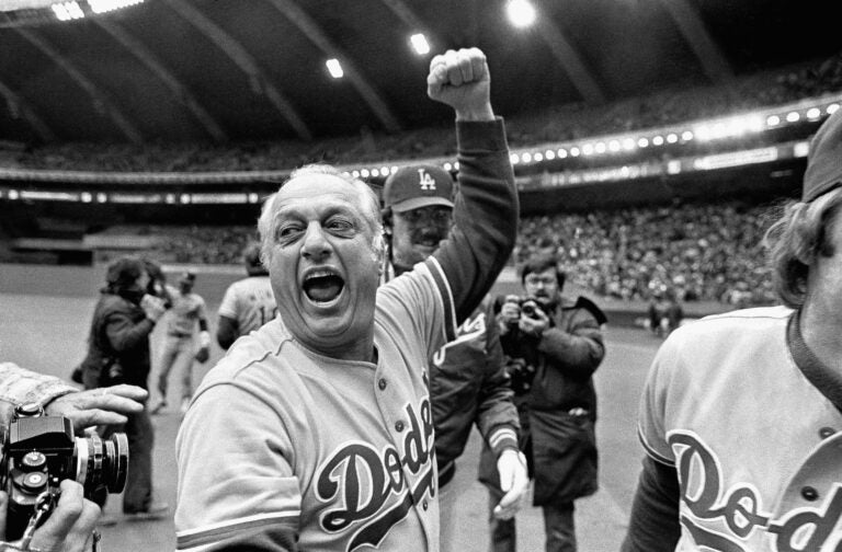 FILE - Los Angeles Dodgers manager Tom Lasorda celebrates after the Dodgers beat the Montreal Expos for the National League title in Montreal, in this Monday, Oct. 19, 1981, file photo. Tommy Lasorda, the fiery Hall of Fame manager who guided the Los Angeles Dodgers to two World Series titles and later became an ambassador for the sport he loved during his 71 years with the franchise, has died. He was 93. The Dodgers said Friday, Jan. 8, 2021, that he had a heart attack at his home in Fullerton, California.  (AP Photo/Grimshaw, File)